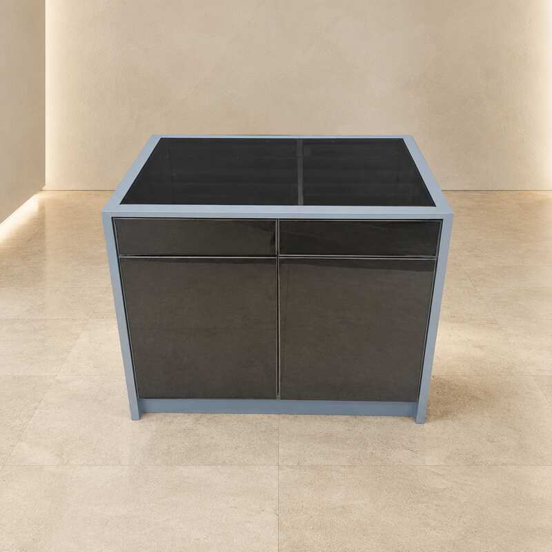 Display cabinet with glass panels on the top and all four sides (front and back).