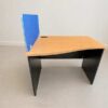 Contoured desk with black wooden legs (available in single-station or double-station configurations) + blue partition.