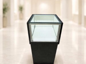 Black glass display cabinet featuring 1 hinged door, 1 drawer, and 1 storage compartment.
