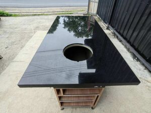 6-seater BBQ table, 190 cm, featuring a built-in pot holder and storage shelf.