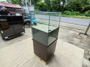 Tall triangular glass display cabinet