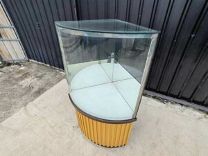 Tall triangular glass display cabinet