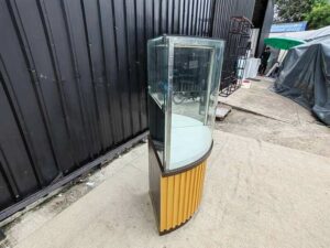Tall triangular glass display cabinet