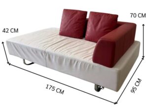 White daybed sofa with red trim, modern style.
