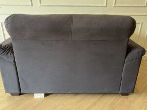 IKEA 2-seater sofa, dark grey fabric upholstery, modern style.