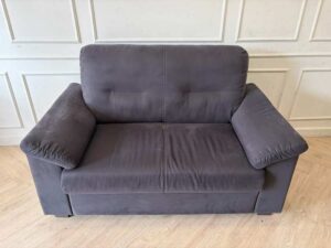 IKEA 2-seater sofa, dark grey fabric upholstery, modern style.