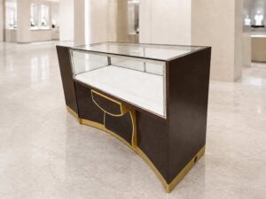 Brown glass display cabinet featuring 2 doors, 2 drawers, and 3 storage compartments.