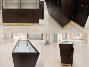 Brown glass display cabinet featuring 2 doors, 2 drawers, and 3 storage compartments.