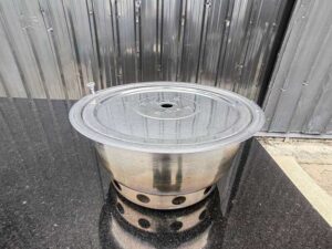 Stainless steel shabu-shabu pot, 35 cm diameter, with lid.