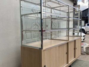 Glass shelving unit and sliding-door storage compartment. (1)