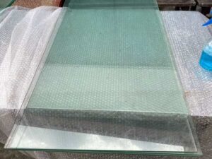 Glass shelving unit and sliding-door storage compartment. (1)