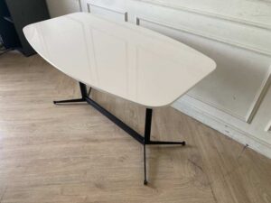 Dining table with wooden top and stainless steel legs. (1)