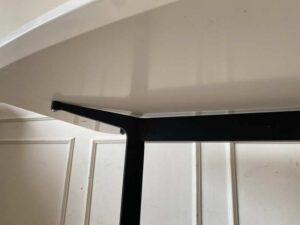Dining table with wooden top and stainless steel legs. (1)