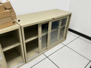 Low-profile steel filing cabinet with sliding glass doors