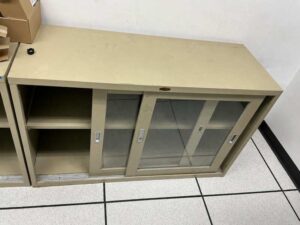 Low-profile steel filing cabinet with sliding glass doors