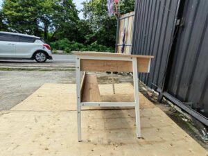 Multipurpose desk, wood grain finish, white legs.