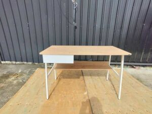 Multipurpose desk, wood grain finish, white legs.