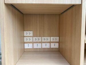 Counter with light-colored wood top, 240 cm