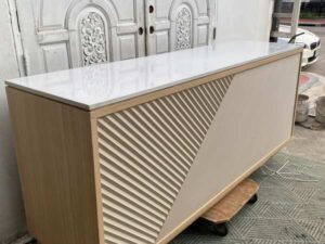 Counter with light-colored wood top, 240 cm