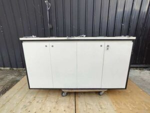 Counter cabinet, white with black trim, featuring shelving and two storage compartments. (4)