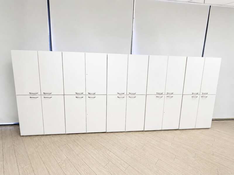 Tall white wooden filing cabinet with 4 hinged doors