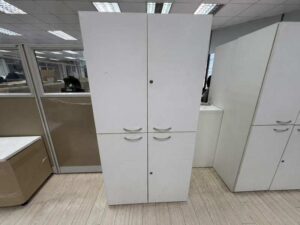 Tall white wooden filing cabinet with 4 hinged doors