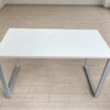 Minimalist office desk with steel legs and white top
