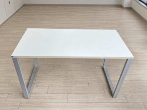 Minimalist office desk with steel legs and white top
