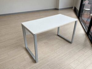 Minimalist office desk with steel legs and white top
