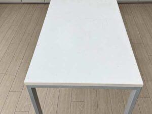 Minimalist office desk with steel legs and white top