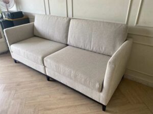 Modern style sofa with light gray fabric upholstery. (1)